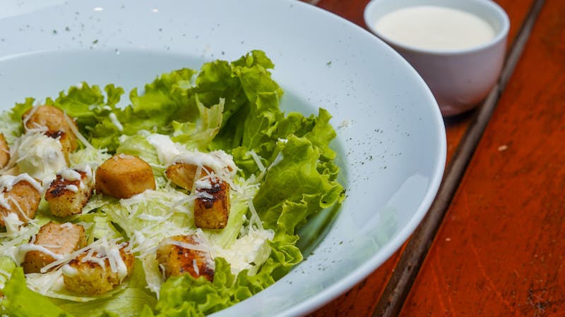 Dions Caesar Salad with croutons and Parmesan cheese