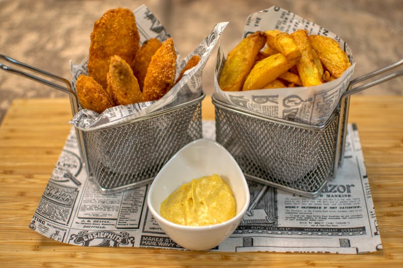 Dions seasoned fries crispy golden with dipping sauce